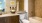 a bathroom with a tub sink and toilet