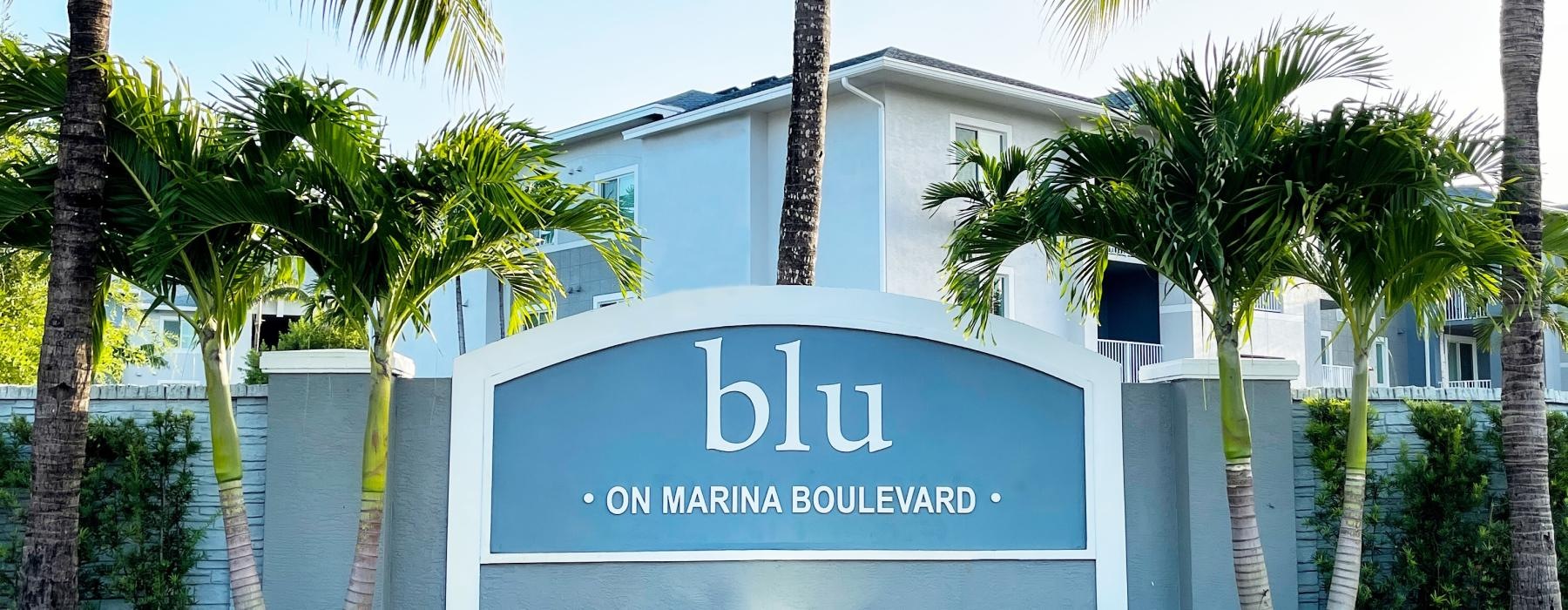 a sign in front of a building