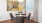 a dining room with a table and chairs